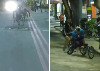 Competidor en arnés de ruedas sufre aparatoso accidente por culpa de una coladera y abandona Maratón